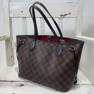 The classic Louis Vuitton Neverfull Damier Ebene PM size tote handbag
